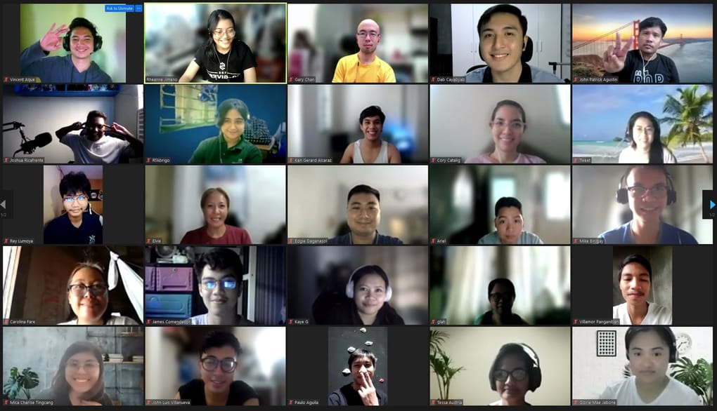 A video-call grid filled with workshop participants.